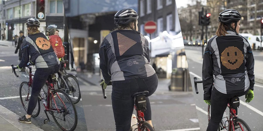 Por mais que a Ford seja conhecida pelos seus carros, essa é a empresa responsável pela Emoji Jacket com a finalidade de ajudar ciclistas a ficarem mais seguros pelas ruas das cidades. A jaqueta vem com um grande painel de led nas costas e, é lá que você apresenta seu humor e se comunica com os motoristas ao seu redor.
